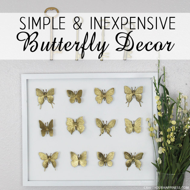 Hard to believe but this beautifully DIY framed butterfly decor piece was made with an old black frame that was missing the glass and some toy butterflies!