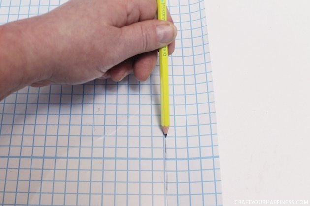 It's super easy to make any size DIY dry erase board using a roll of adhesive backed dry erase paper. We made a kitchen board and added some extras including making our own eraser!