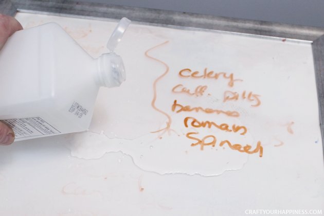 It's super easy to make any size DIY dry erase board using a roll of adhesive backed dry erase paper. We made a kitchen board and added some extras including making our own eraser!