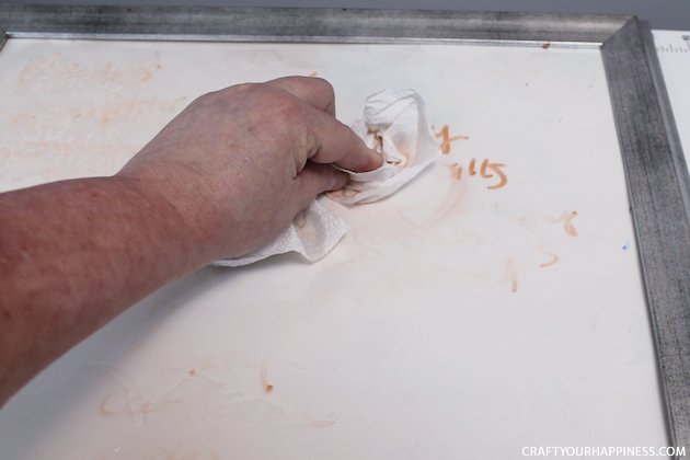 It's super easy to make any size DIY dry erase board using a roll of adhesive backed dry erase paper. We made a kitchen board and added some extras including making our own eraser!