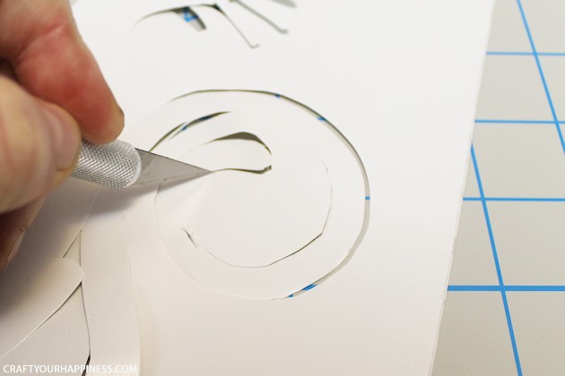 Making stencils from contact paper is cheap, lets you cut your own designs, you can make really big stencils and best of all, the stencil stays in place!