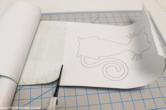 Making stencils from contact paper is cheap, lets you cut your own designs, you can make really big stencils and best of all, the stencil stays in place!