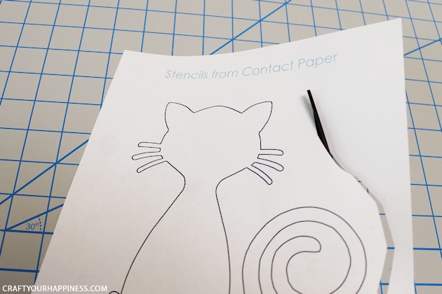 Making stencils from contact paper is cheap, lets you cut your own designs, you can make really big stencils and best of all, the stencil stays in place!