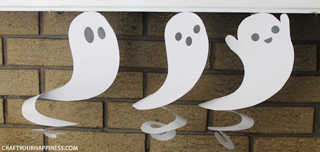 Need quick Halloween decorations? Grab our printables, some scissors or X-acto knife and before you know it you have have a room full of dangling ghosts!