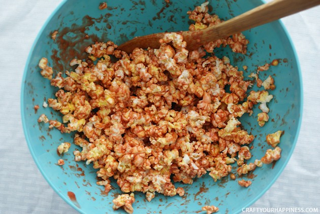 Hand out these giant eye popping halloween popcorn balls and you'll be the favorite house on the block! Also great for parties. Healthy recipe included!