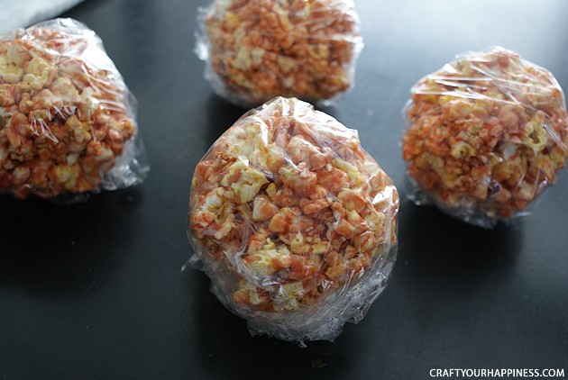 Hand out these giant eye popping halloween popcorn balls and you'll be the favorite house on the block! Also great for parties. Healthy recipe included!