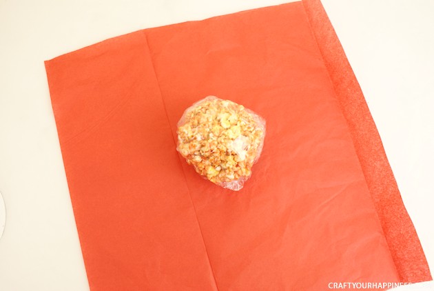 Hand out these giant eye popping halloween popcorn balls and you'll be the favorite house on the block! Also great for parties. Healthy recipe included!