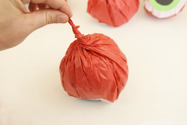 Hand out these giant eye popping halloween popcorn balls and you'll be the favorite house on the block! Also great for parties. Healthy recipe included!