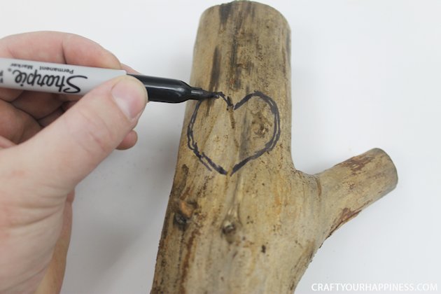 If you're looking for a unique gift idea for couples this darling carved sweetheart branch is perfect and inexpensive. You can make it with a couple of carving tools, which are cheap, and a marker. Or if you happen to own a rotary or Dremel tool and/or a wood burner, you can use those. We show both ways of making it.