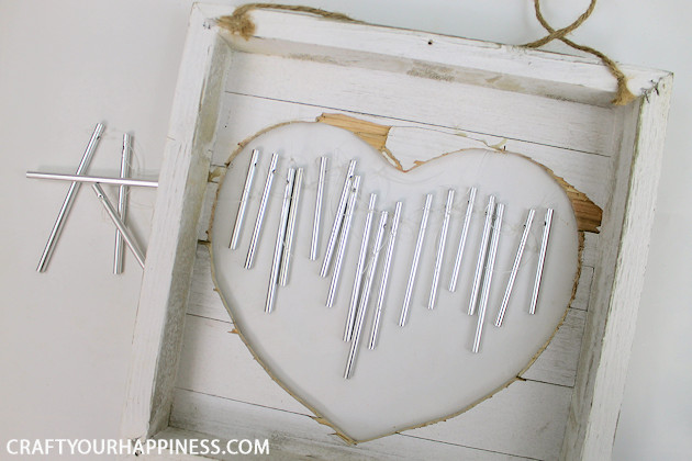 These unique farmhouse style DIY wind chimes can be hung on a wall  instead of from the eaves on your porc