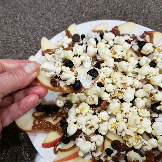Our delicious Apple Nachos Supreme dessert recipe is perfect for parties, movie night or a healthy snack for kids. Includes our fabulous date caramel sauce!