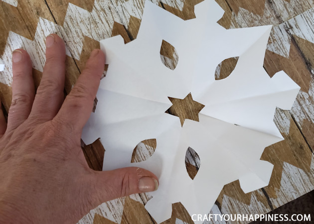 Make a Winter Wonderland for Pennies using only white paper, scissors and a stapler! Twinkle lights optional.  Free Snowflake Patterns included!