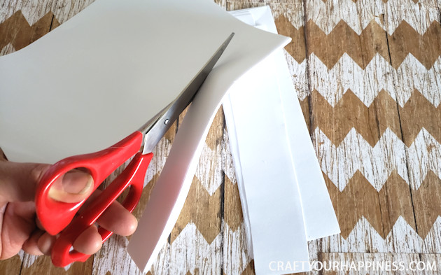 Make a Winter Wonderland for Pennies using only white paper, scissors and a stapler! Twinkle lights optional.  Free Snowflake Patterns included!