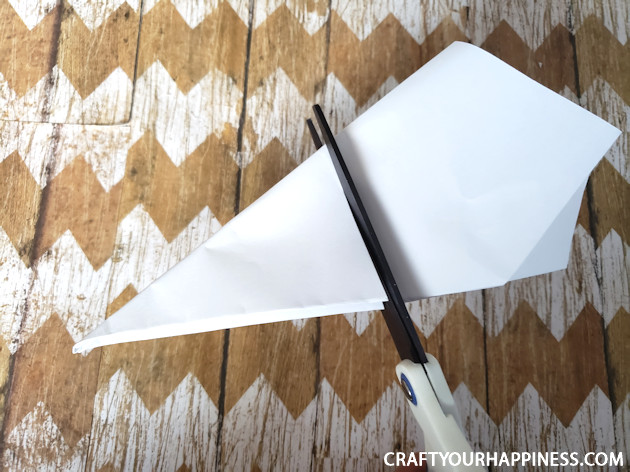 Make a Winter Wonderland for Pennies using only white paper, scissors and a stapler! Twinkle lights optional.  Free Snowflake Patterns included!