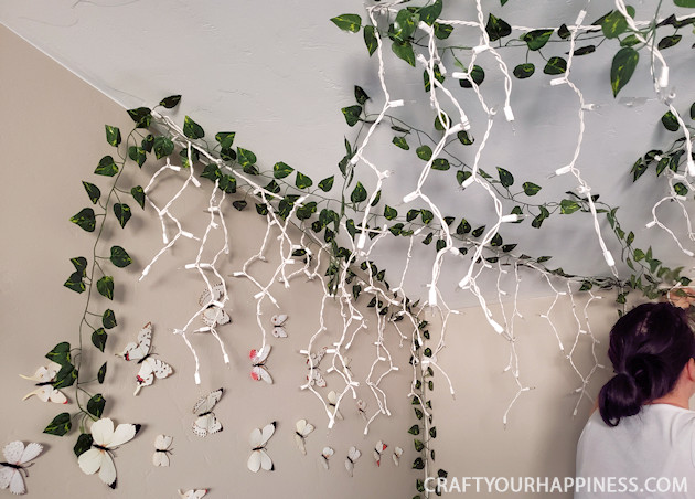 Looking for unusual inexpensive ceiling decorating ideas? Learn how to make our woodland twinkle light ceiling decor project. It's breathtaking!