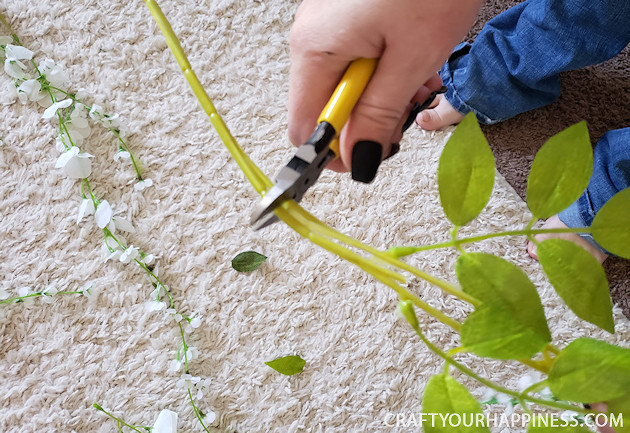 Looking for unusual inexpensive ceiling decorating ideas? Learn how to make our woodland twinkle light ceiling decor project. It's breathtaking!