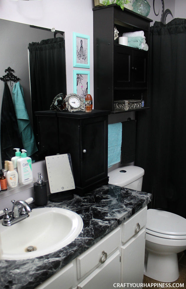 If you're looking for a unique bathroom makeover wait till you see how we turned a bleh master bathroom into a magical dark sea theme.