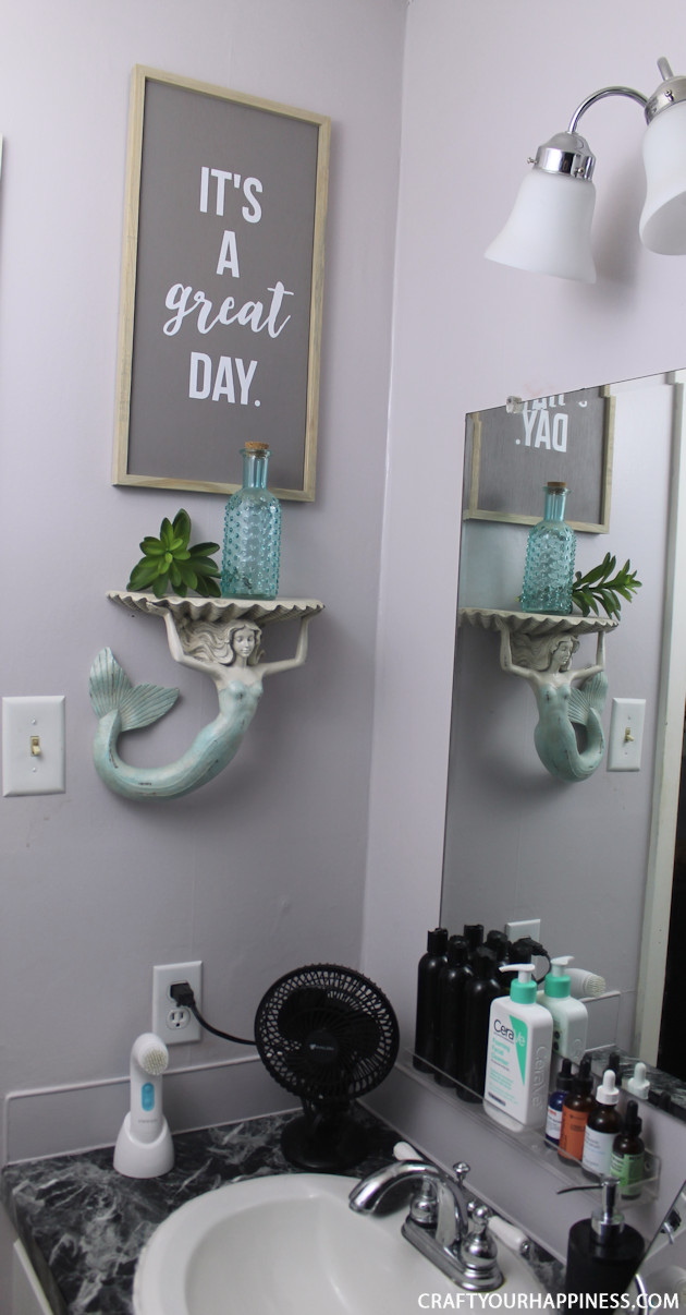 If you're looking for a unique bathroom makeover wait till you see how we turned a bleh master bathroom into a magical dark sea theme.