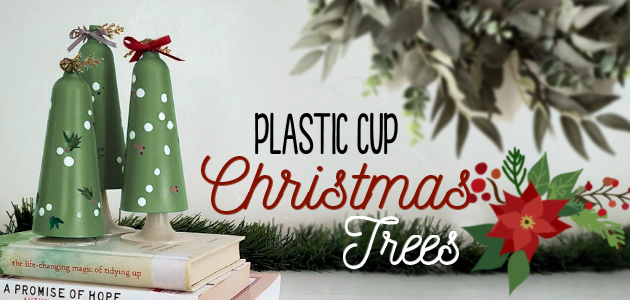 Looking for a simple DIY holiday craft? Make these plastic cup Christmas tree tabletop decor with champaign flutes from the dollar store!