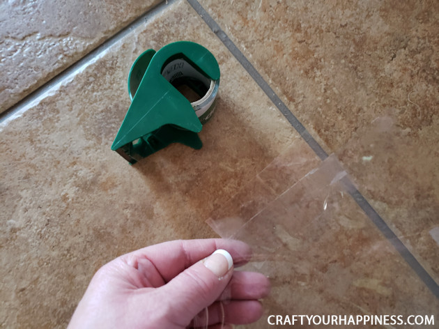 If you live where it's extremely hot or cold and have a screen door with no glass here is a fairly simple DIY removable clear screen door cover you can make for minimal cost.