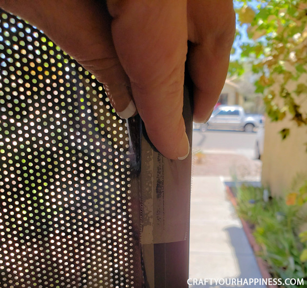 If you live where it's extremely hot or cold and have a screen door with no glass here is a fairly simple DIY removable clear screen door cover you can make for minimal cost.