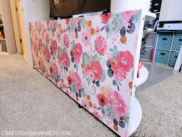 Do you have a desk that sticks out into your room exposing all your cables and cords? We’ve come up with an inexpensive foam board panel to hide your cords and look beautiful at the same time!