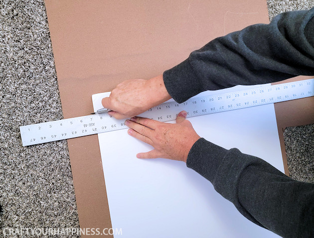 Do you have a desk that sticks out into your room exposing all your cables and cords? We’ve come up with an inexpensive foam board panel to hide your cords and look beautiful at the same time!