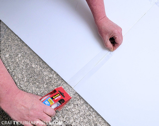 Do you have a desk that sticks out into your room exposing all your cables and cords? We’ve come up with an inexpensive foam board panel to hide your cords and look beautiful at the same time!