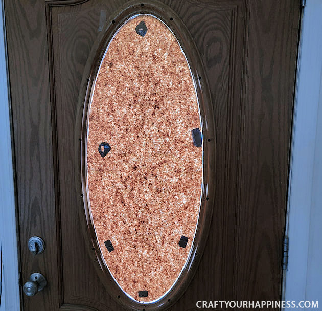 All you need is 3 things to make this lovely simple DIY wood door oval window cover for privacy and it's not only inexpensive it's removable!