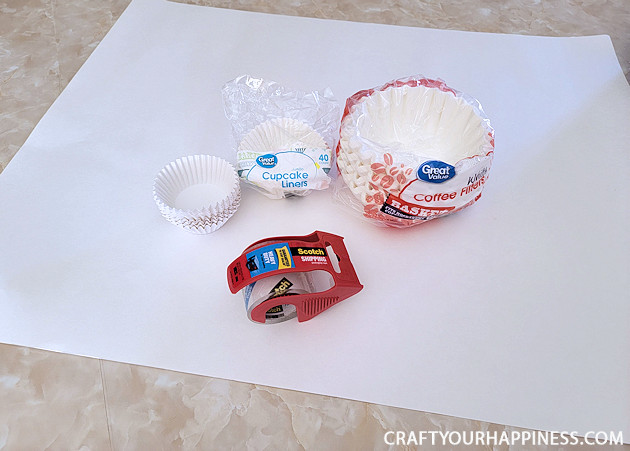 All you need to make a simple classy coffee filter Christmas tree is a piece of poster board, some tape and coffee filters and 20 minutes!