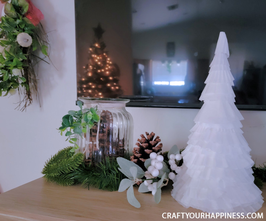 All you need to make a simple classy coffee filter Christmas tree is a piece of poster board, some tape and coffee filters and 20 minutes!