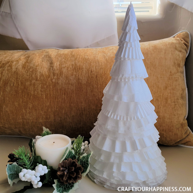 All you need to make a simple classy coffee filter Christmas tree is a piece of poster board, some tape and coffee filters and 20 minutes!