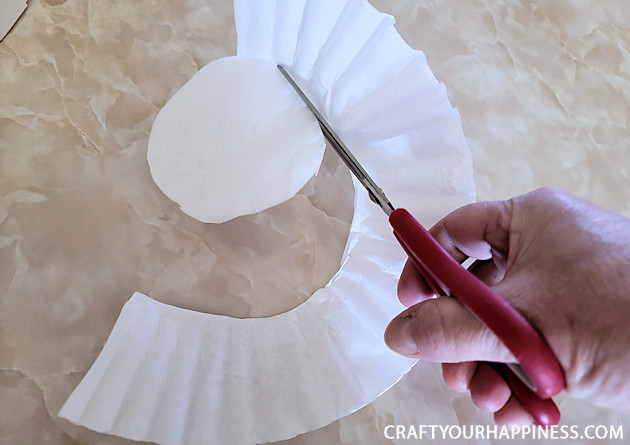 All you need to make a simple classy coffee filter Christmas tree is a piece of poster board, some tape and coffee filters and 20 minutes!