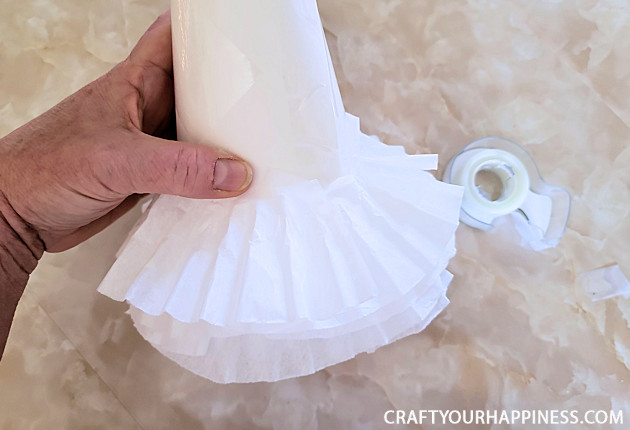 All you need to make a simple classy coffee filter Christmas tree is a piece of poster board, some tape and coffee filters and 20 minutes!