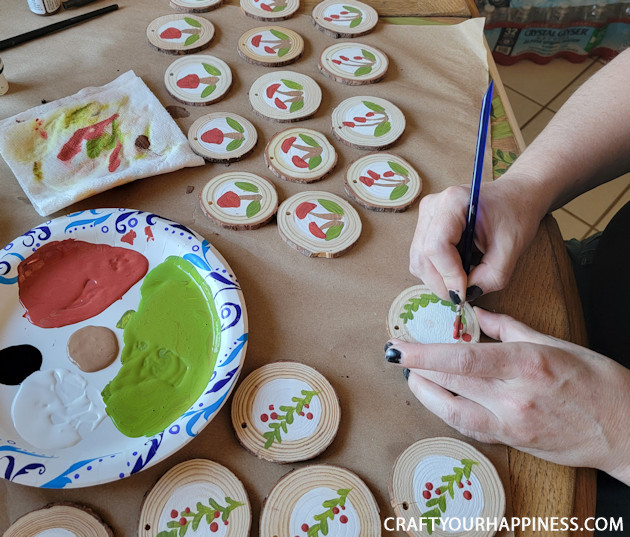 DIY paint your own wood slices Christmas ornaments for an earthy whimsical holiday vibe! You can buy the discs or cut your own!