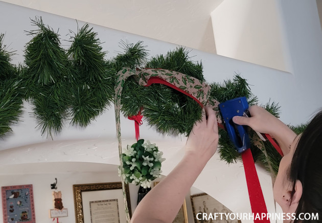 Brighten up your holiday and deck your halls by making your own fancy DIY garland from plain green garland. 