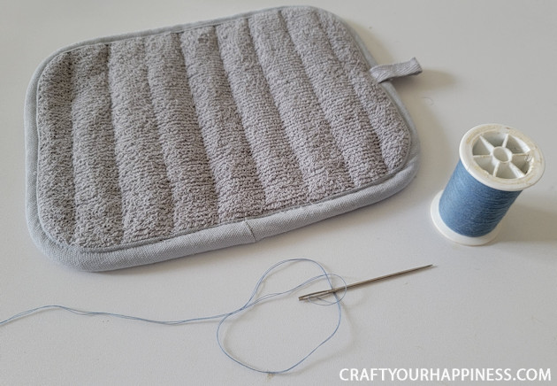 Make a DIY bowl cozy using a $2 hot pad! No more burned fingers trying to get a hot bowl out of the microwave. (No sewing machine needed!)