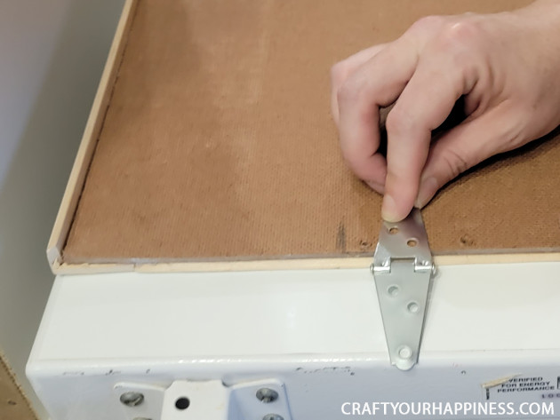 Learn how to make a chest freezer cover that lifts and can be painted or covered any way you like!  (It can also conceal an inventory list.)