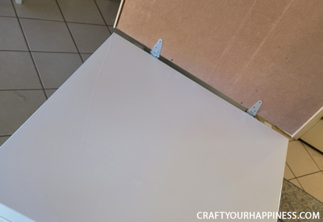 Learn how to make a chest freezer cover that lifts and can be painted or covered any way you like!  (It can also conceal an inventory list.)