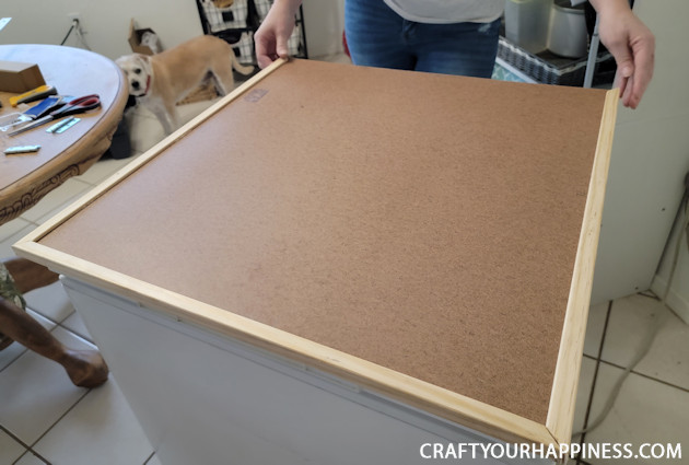 Learn how to make a chest freezer cover that lifts and can be painted or covered any way you like!  (It can also conceal an inventory list.)