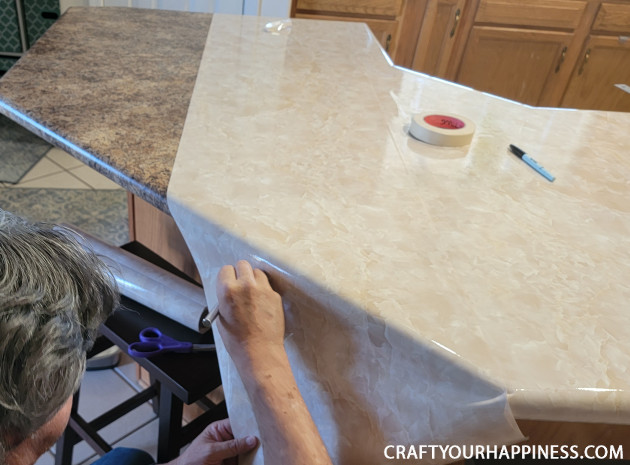 Learning how to cover a countertop with contact paper is easier than you think! It can last a long time if you're careful with it!