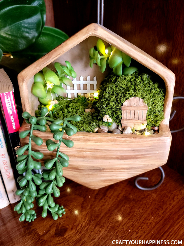 Get Inspired and check out this small hanging planter we turned into a whimsical fairy garden! 
